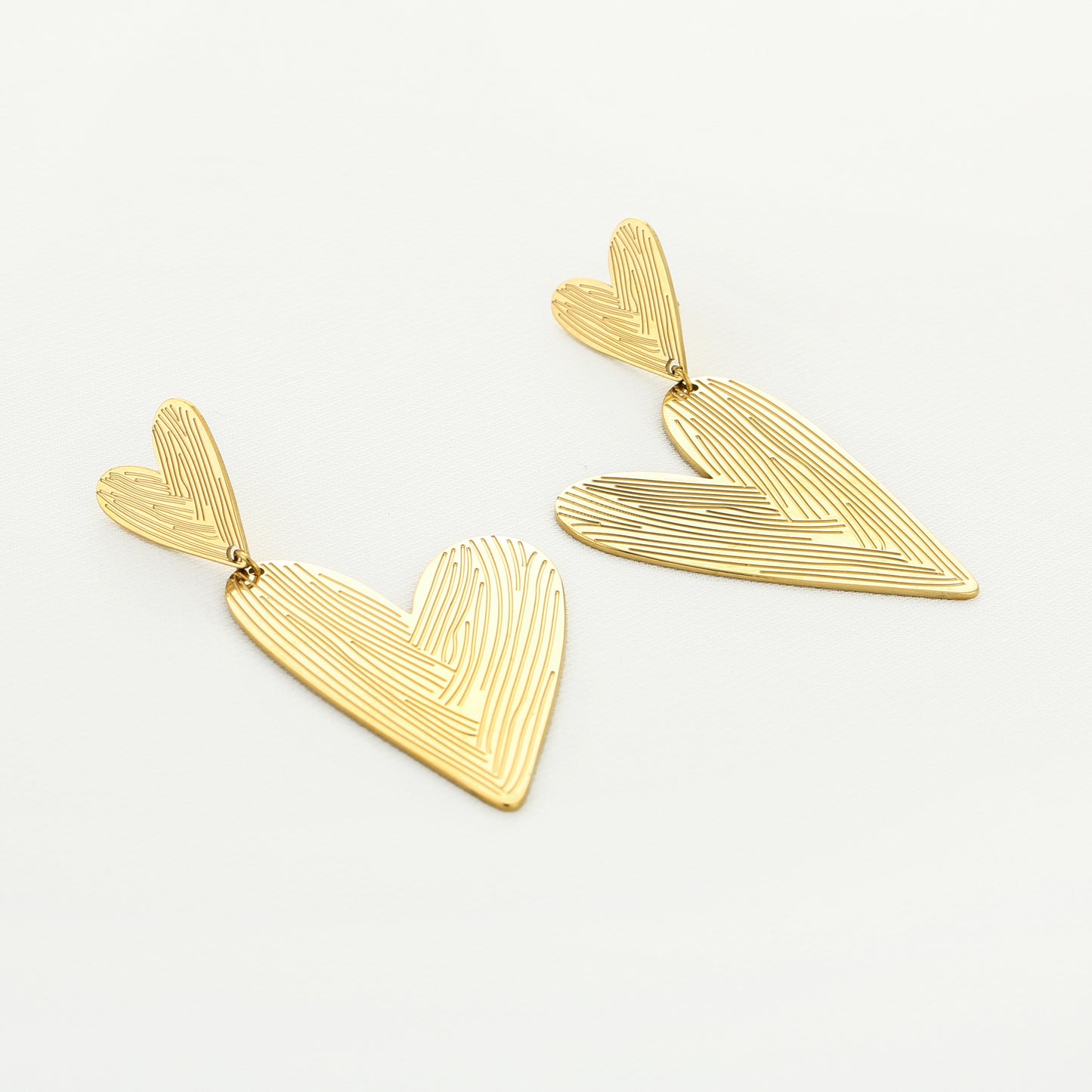 Double love - Statement oorbellen met groot en klein hartje