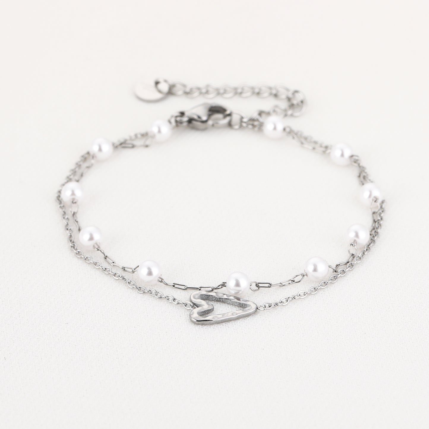 Dubbele armband met hartje en parels
