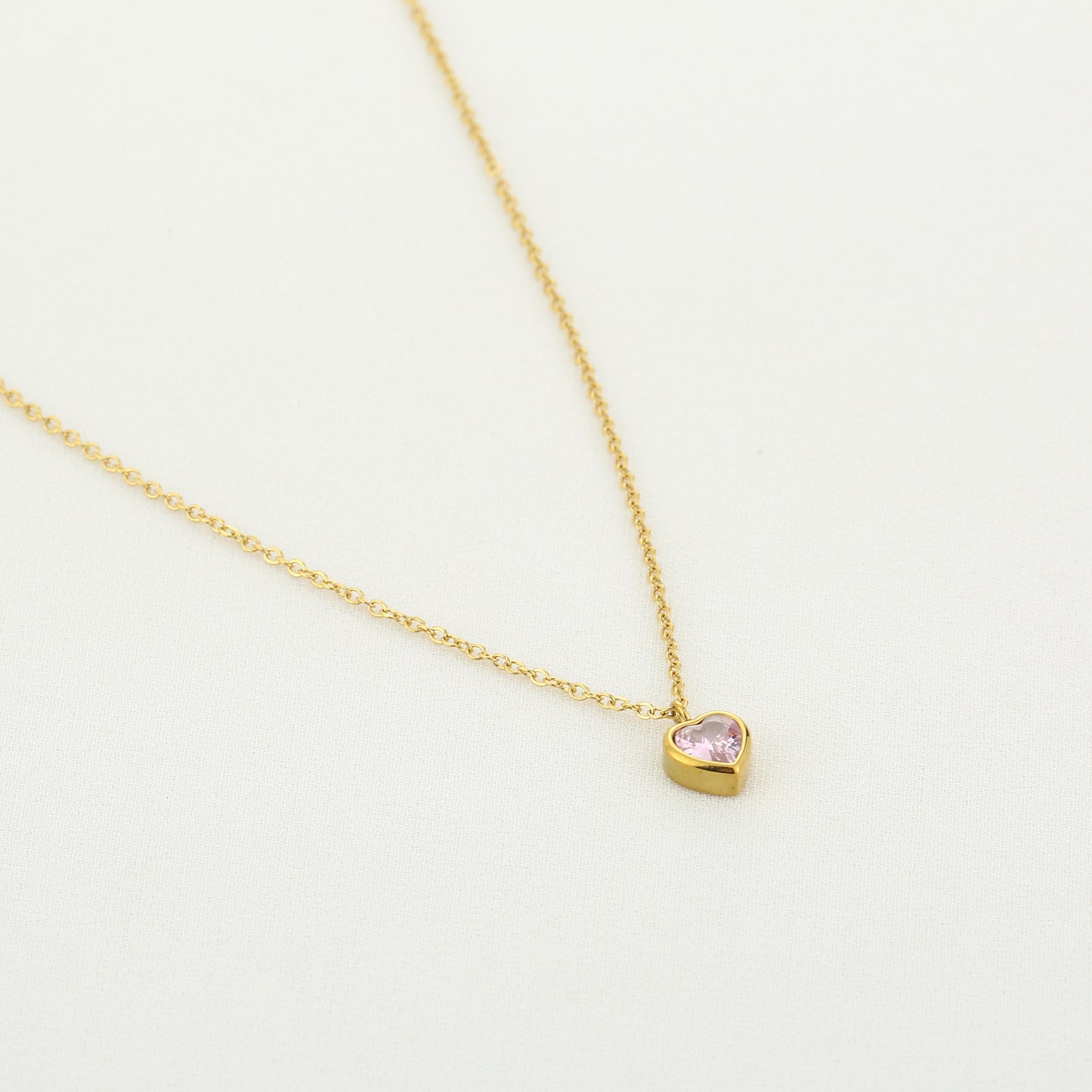 Hartjes ketting met roze steentje